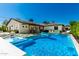 Stunning pool and backyard featuring a covered patio, lush landscaping, and comfortable lounge chairs at 4021 E Glenrosa Ave, Phoenix, AZ 85018