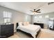 Bright bedroom featuring a bed, dresser, mirror and lots of natural light at 4046 S 58Th Ln, Phoenix, AZ 85043