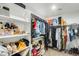 Walk-in closet with shelving and racks for storage at 4046 S 58Th Ln, Phoenix, AZ 85043