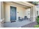 Inviting front porch featuring stylish seating and a welcoming entrance to the home at 4046 S 58Th Ln, Phoenix, AZ 85043