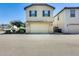 Two-story home featuring a two-car garage with landscaped front yard at 4046 S 58Th Ln, Phoenix, AZ 85043