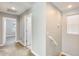 Upstairs hallway featuring carpet flooring, neutral paint, and access to multiple rooms at 4046 S 58Th Ln, Phoenix, AZ 85043