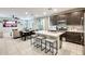 Stylish kitchen featuring an island with seating, stainless steel appliances, and an open layout at 4046 S 58Th Ln, Phoenix, AZ 85043