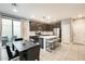 Open-concept kitchen with stainless steel appliances, a large island, and adjacent dining area at 4046 S 58Th Ln, Phoenix, AZ 85043