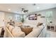 Bright and open living area with a large sectional sofa and modern decor at 4046 S 58Th Ln, Phoenix, AZ 85043