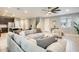 Spacious living area with kitchen view, featuring comfortable seating and neutral color palette at 4046 S 58Th Ln, Phoenix, AZ 85043