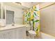 Bright bathroom featuring lemon-themed shower curtain and vanity at 4441 E Desert Wind Dr, Phoenix, AZ 85044