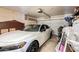Spacious garage with a white car parked inside and storage cabinets at 4441 E Desert Wind Dr, Phoenix, AZ 85044