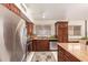Galley kitchen with stainless steel appliances and granite countertops at 4441 E Desert Wind Dr, Phoenix, AZ 85044
