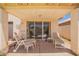 Covered patio with lounge chairs, view of the pool, and desert landscape at 4441 E Desert Wind Dr, Phoenix, AZ 85044