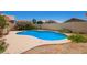 Backyard pool with desert landscaping, providing privacy for swimming at 4441 E Desert Wind Dr, Phoenix, AZ 85044
