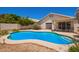 Beautiful swimming pool with a patio area and views of the house at 4441 E Desert Wind Dr, Phoenix, AZ 85044