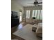 Bright bedroom features natural light, modern ceiling fan, desk, and outdoor access at 4628 W Whispering Wind Dr, Glendale, AZ 85310