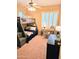 Bedroom features a bunk bed, desk with a lamp, and natural light at 4628 W Whispering Wind Dr, Glendale, AZ 85310