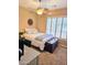 Cozy bedroom boasts ample natural light, a stylish desk, and a decorative chest at 4628 W Whispering Wind Dr, Glendale, AZ 85310