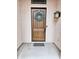 Elegant wooden front door adorned with a wreath, adding a welcoming touch to the entrance at 4628 W Whispering Wind Dr, Glendale, AZ 85310