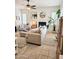 Inviting living room with fireplace, neutral tones, and shuttered windows at 4628 W Whispering Wind Dr, Glendale, AZ 85310