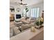 Bright living room with fireplace, plush seating, and natural light at 4628 W Whispering Wind Dr, Glendale, AZ 85310