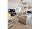Comfortable living area featuring a fireplace, ceiling fan, and TV at 4628 W Whispering Wind Dr, Glendale, AZ 85310