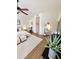 Bright main bedroom with modern decor and home gym setup at 4628 W Whispering Wind Dr, Glendale, AZ 85310