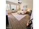 Serene main bedroom with ample natural light and wood-look floors at 4628 W Whispering Wind Dr, Glendale, AZ 85310