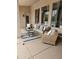 Relaxing outdoor patio with comfortable wicker seating and a stylish rug at 4628 W Whispering Wind Dr, Glendale, AZ 85310