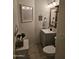 Well-lit powder room features coastal decorations, small vanity, and artwork at 4628 W Whispering Wind Dr, Glendale, AZ 85310