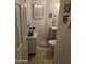 Stylish powder room with coastal decor and compact vanity at 4628 W Whispering Wind Dr, Glendale, AZ 85310