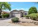 Charming single-story home with a manicured front yard and attached two-car garage at 4712 E Lone Cactus Dr, Phoenix, AZ 85050