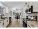 Bright kitchen with stainless appliances, marble counters and eat-in breakfast nook at 4712 E Lone Cactus Dr, Phoenix, AZ 85050