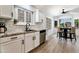 Bright kitchen with stainless appliances, white cabinets and eat-in breakfast nook at 4712 E Lone Cactus Dr, Phoenix, AZ 85050