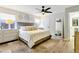Calming main bedroom with neutral colors, tray ceiling, and ceiling fan at 4712 E Lone Cactus Dr, Phoenix, AZ 85050