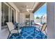 Covered patio with stylish seating and a ceiling fan, perfect for outdoor relaxation at 4712 E Lone Cactus Dr, Phoenix, AZ 85050