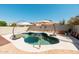 Beautiful backyard pool with a charming waterfall feature for outdoor enjoyment at 4712 E Lone Cactus Dr, Phoenix, AZ 85050