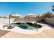 Beautiful backyard pool with a charming waterfall feature for outdoor enjoyment at 4712 E Lone Cactus Dr, Phoenix, AZ 85050