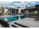 Modern backyard featuring a pool, tile patio, lounge seating, and elegant exterior elevation at 4864 E Lafayette Blvd, Phoenix, AZ 85018