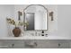 Bright bathroom with white marble counters, stylish fixtures, decorative accents and doorway view to the shower at 4864 E Lafayette Blvd, Phoenix, AZ 85018