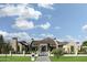 A grand estate featuring lush landscaping, a symmetrical facade, and wrought iron fencing at 4864 E Lafayette Blvd, Phoenix, AZ 85018
