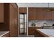 Elegant kitchen featuring custom cabinetry, marble countertops, and a view into the pantry at 4864 E Lafayette Blvd, Phoenix, AZ 85018