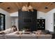 Elegant living room featuring a fireplace, wood ceiling, and modern decor at 4864 E Lafayette Blvd, Phoenix, AZ 85018