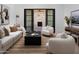 Bright living room with a fireplace and access to the outdoor patio at 4864 E Lafayette Blvd, Phoenix, AZ 85018
