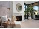 Cozy living room with a fireplace and large sliding glass doors to the outside at 4864 E Lafayette Blvd, Phoenix, AZ 85018