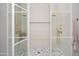 Luxurious glass enclosed shower featuring multiple shower heads and marble floors at 4864 E Lafayette Blvd, Phoenix, AZ 85018