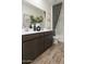 This bathroom features a double sink vanity, under-mount sinks and hard surface flooring at 4920 W Walatowa St, Laveen, AZ 85339
