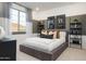 This bedroom features a view, grey color palette, and modern décor at 4920 W Walatowa St, Laveen, AZ 85339