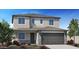 Charming two-story home featuring stone accents and a well-manicured front yard at 4920 W Walatowa St, Laveen, AZ 85339