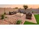 This backyard retreat offers a cozy fire pit area with comfortable seating on a beautifully designed paver patio at 4920 W Walatowa St, Laveen, AZ 85339