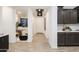 Inviting hallway features modern lighting and seamlessly connects the kitchen to the office at 4920 W Walatowa St, Laveen, AZ 85339