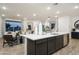 Spacious island kitchen flows into the living room, perfect for entertaining and Gathering gatherings at 4920 W Walatowa St, Laveen, AZ 85339