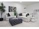 Spacious living room features a comfortable sofa, modern decor, and elegant design elements at 4920 W Walatowa St, Laveen, AZ 85339
